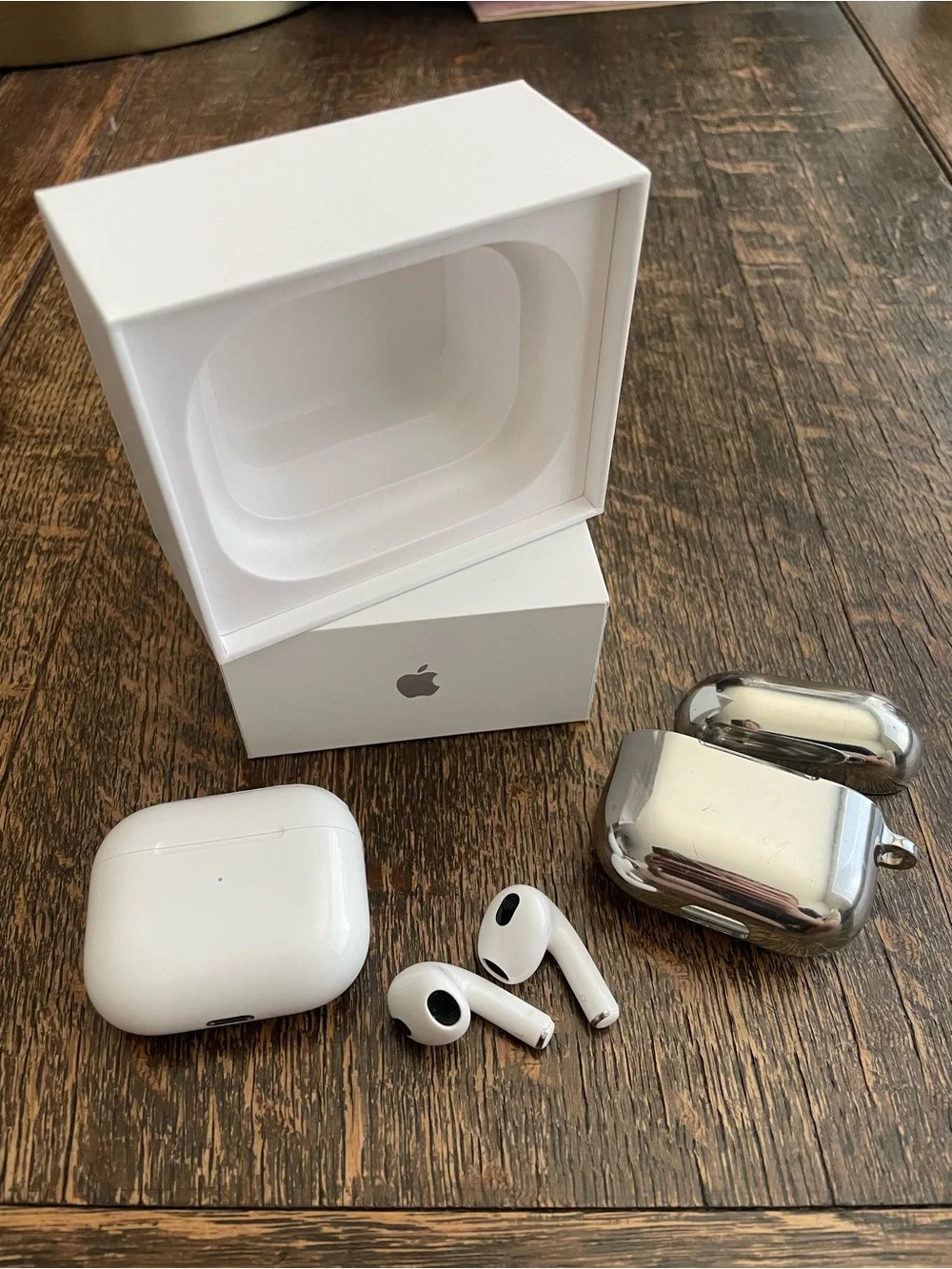 Apple White AirPods 3 with Charging Case and Silver Casetify Protective Case